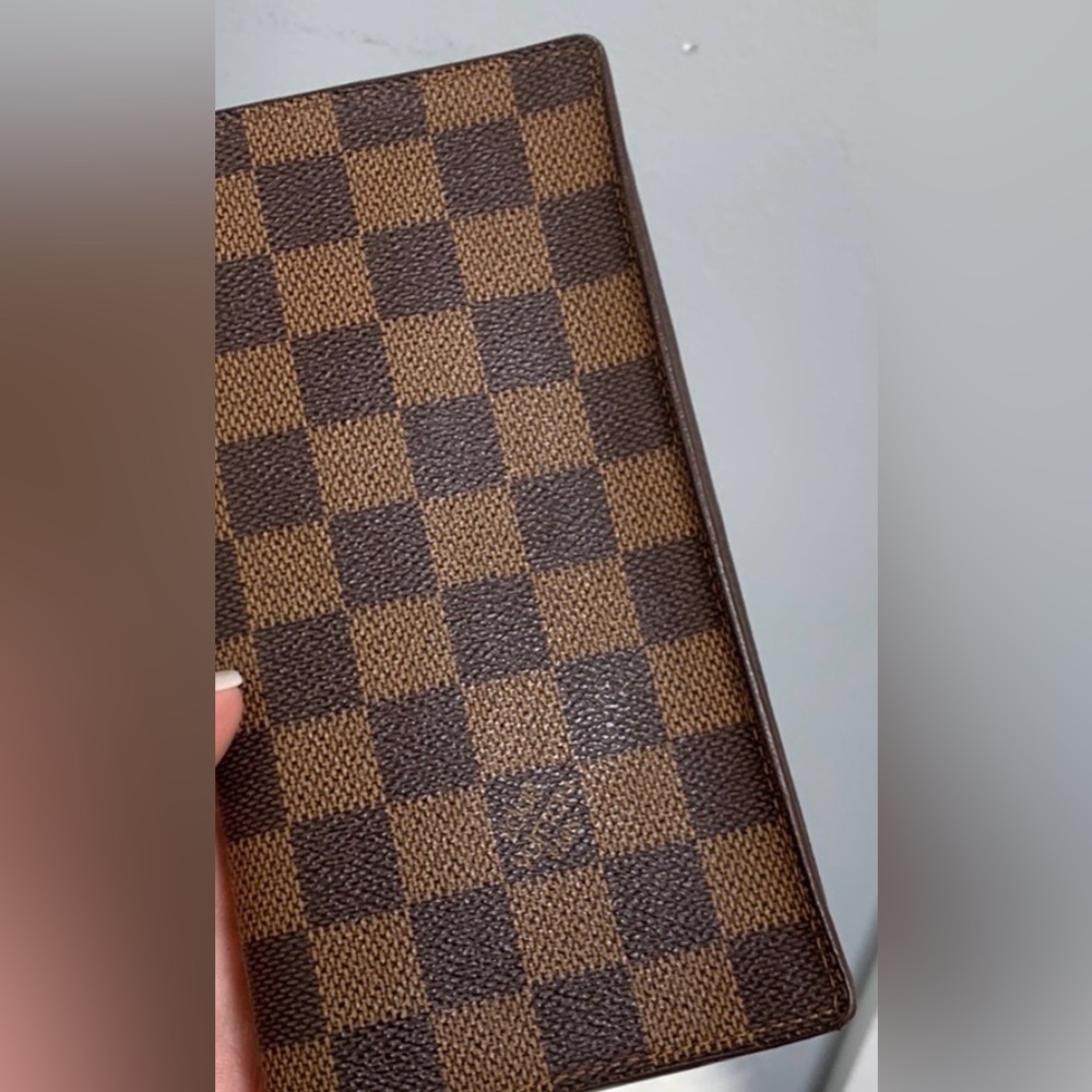 100% authentic Louis Vuitton Damier Ebene (DE) long vertical wallet organizer.